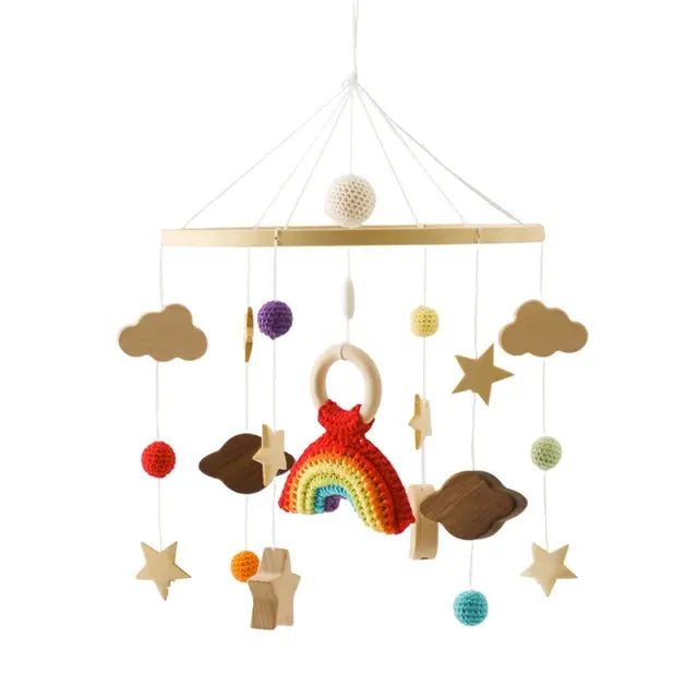 Musical crib mobile fitted to the side of a cot