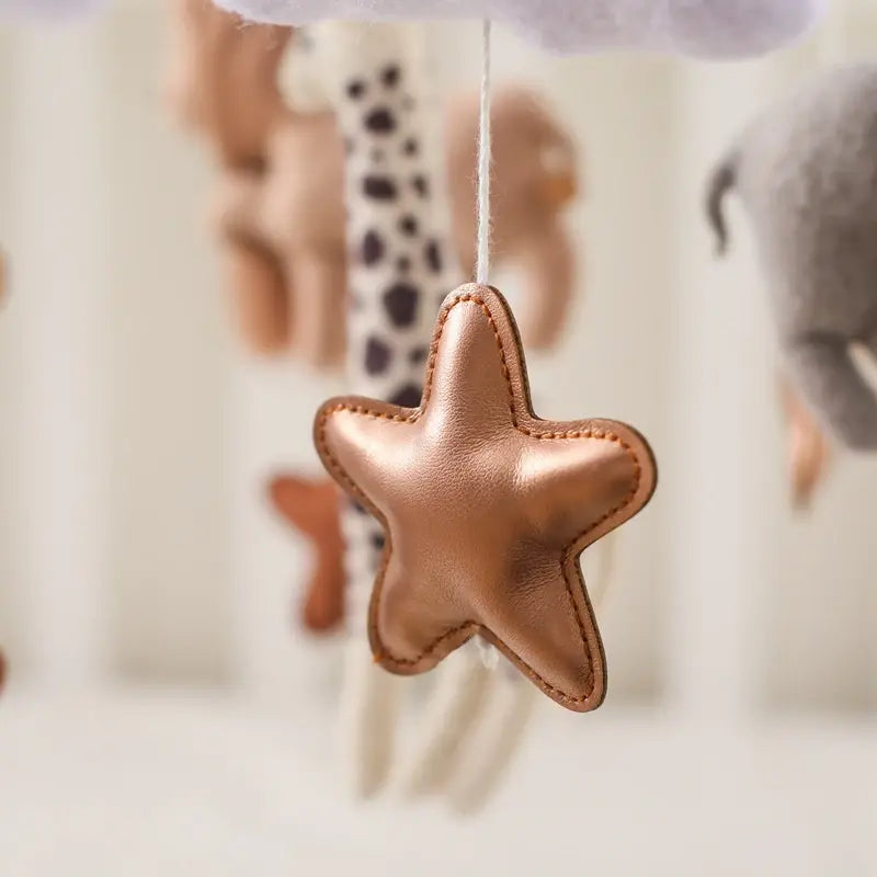 Crib mobile arm and cot clamp shown in detail