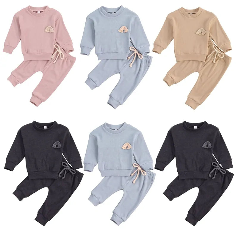 Baby top with rainbow embroidery and matching trousers