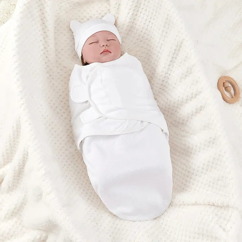 Newborn wrapped in the cotton swaddle blanket