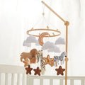 Musical crib mobile with hanging characters above a cot