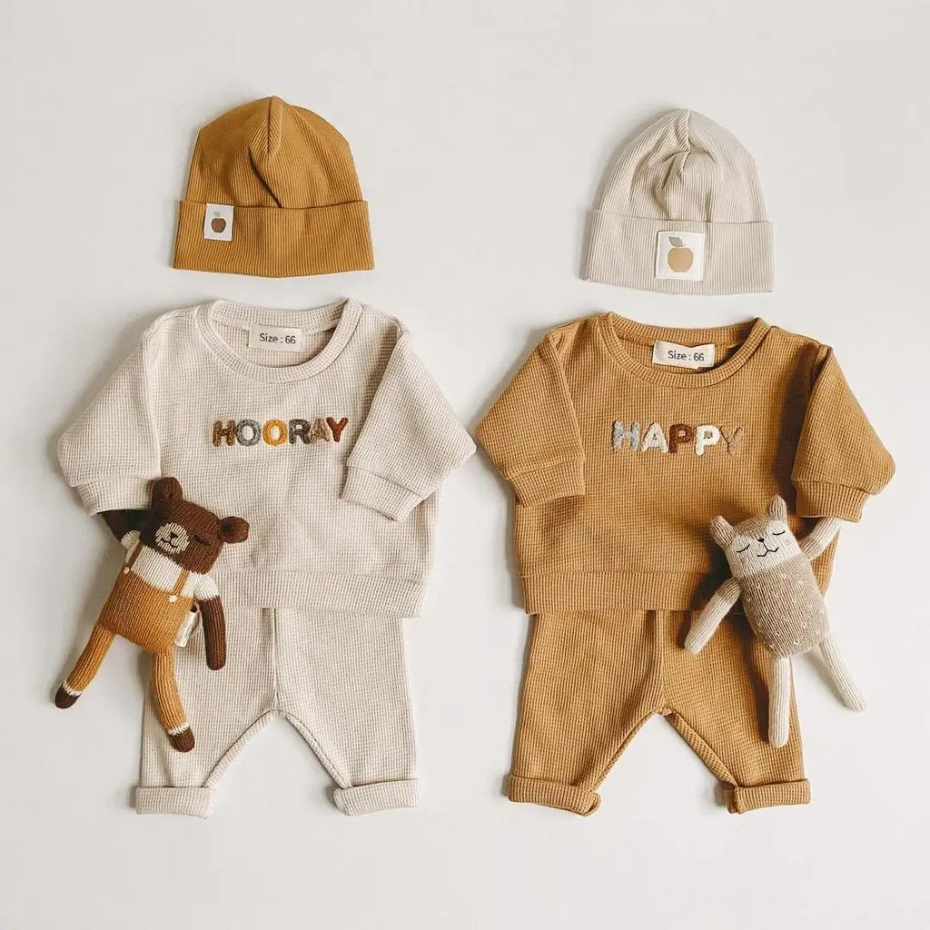 Baby top and trousers set in ivory