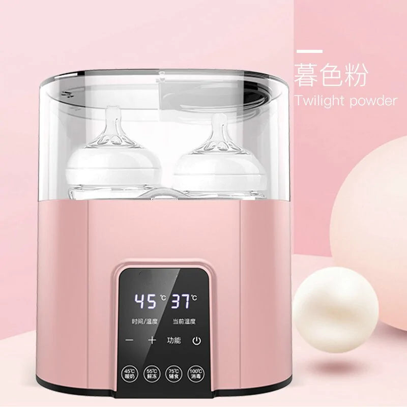 Baby bottle warmer with a bottle in place and the display lit